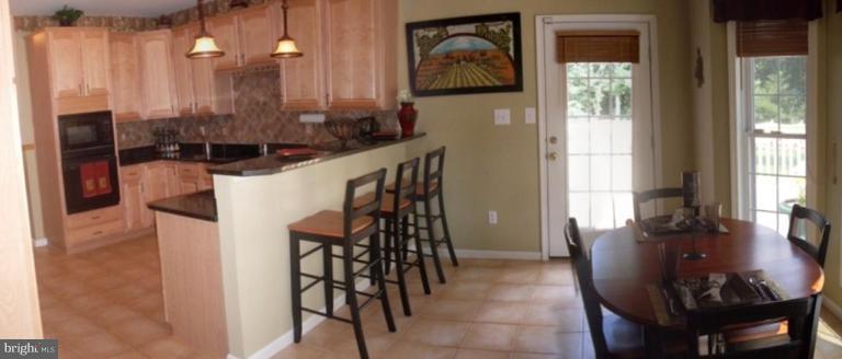 909 Wieker Road Severn, MD 21144 - Photo 5 of 30 Granite counter tops, ceramic tile flooring.