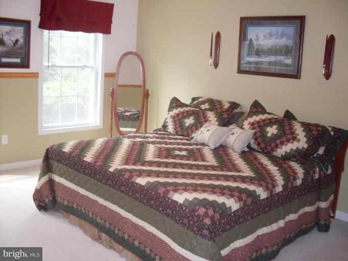 909 Wieker Road Severn, MD 21144 - Photo 7 of 30 Upstairs master bedroom 15' by 13'