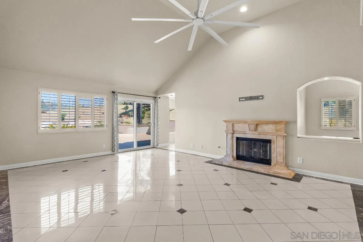 404 Summerhill Terrace Alpine, CA 91901 - Photo 14 of 40 an empty room with windows and fireplace
