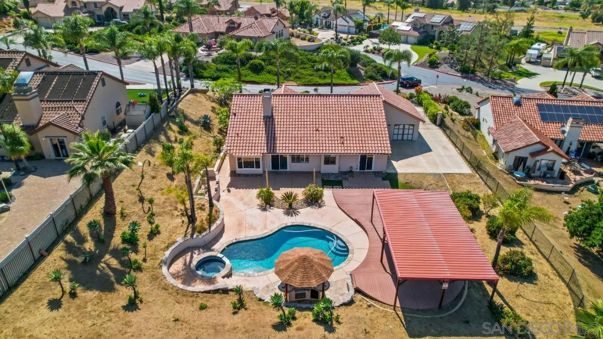 404 Summerhill Terrace Alpine, CA 91901 - Photo 2 of 40 an aerial view of a house with swimming pool and large trees