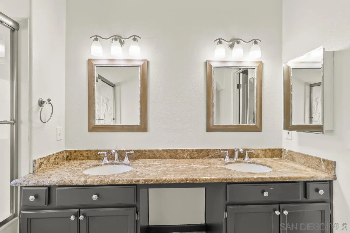 404 Summerhill Terrace Alpine, CA 91901 - Photo 24 of 40 a bathroom with a granite countertop sink and a mirror
