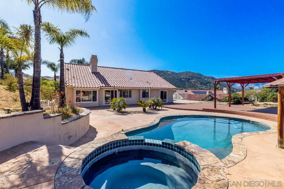 404 Summerhill Terrace Alpine, CA 91901 - Photo 33 of 40 a view of a house with swimming pool and sitting area