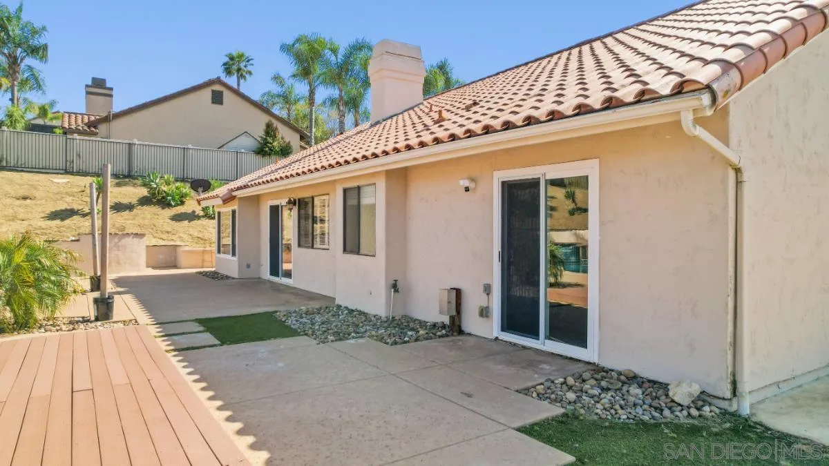 404 Summerhill Terrace Alpine, CA 91901 - Photo 34 of 40 a front view of a house with a yard and potted plants