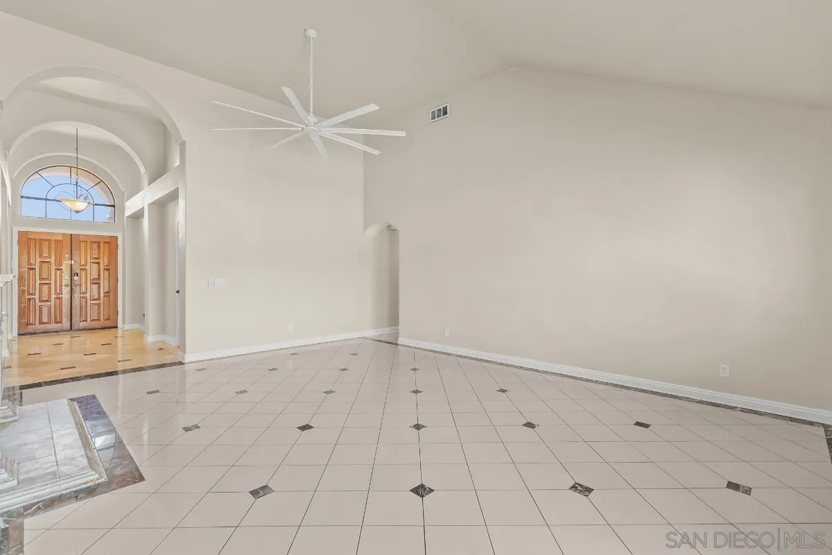 404 Summerhill Terrace Alpine, CA 91901 - Photo 5 of 40 an empty room with white walls and tiles