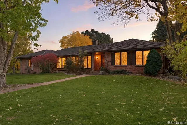 a living room with fireplace furniture and a flat screen tv