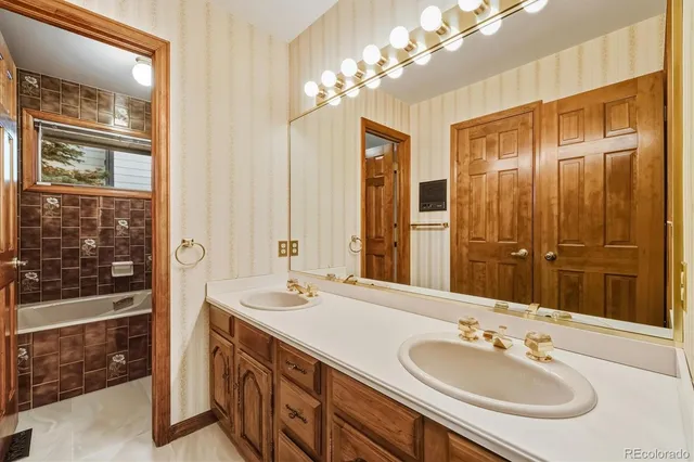 a spacious bedroom with a bed and a window