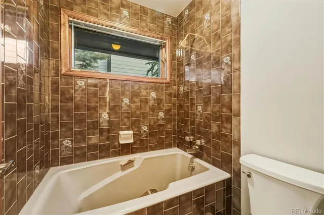 a picture of a bathroom with a shower