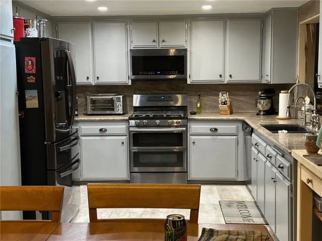 a bedroom with bed and a window