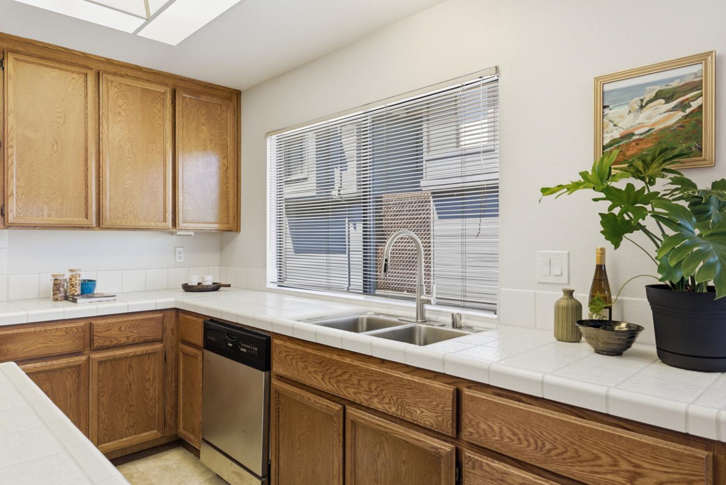 1669 Geary Road Walnut Creek, CA 94597 - Photo 15 of 39 a kitchen with stainless steel appliances granite countertop a sink a stove and cabinets