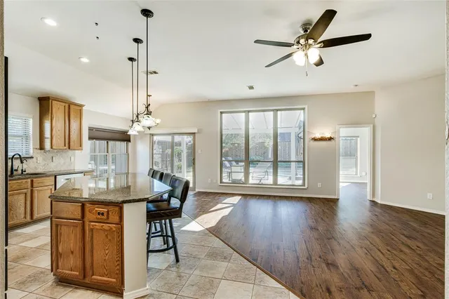 a view of a livingroom with furniture window and wooden floor