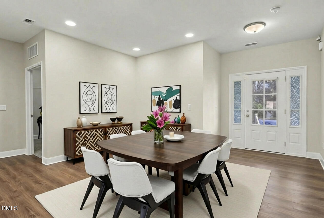 1946 Payne Road Haw River, NC 27258 - Photo 16 of 37 a view of a dining room with furniture wooden floor and a potted plant