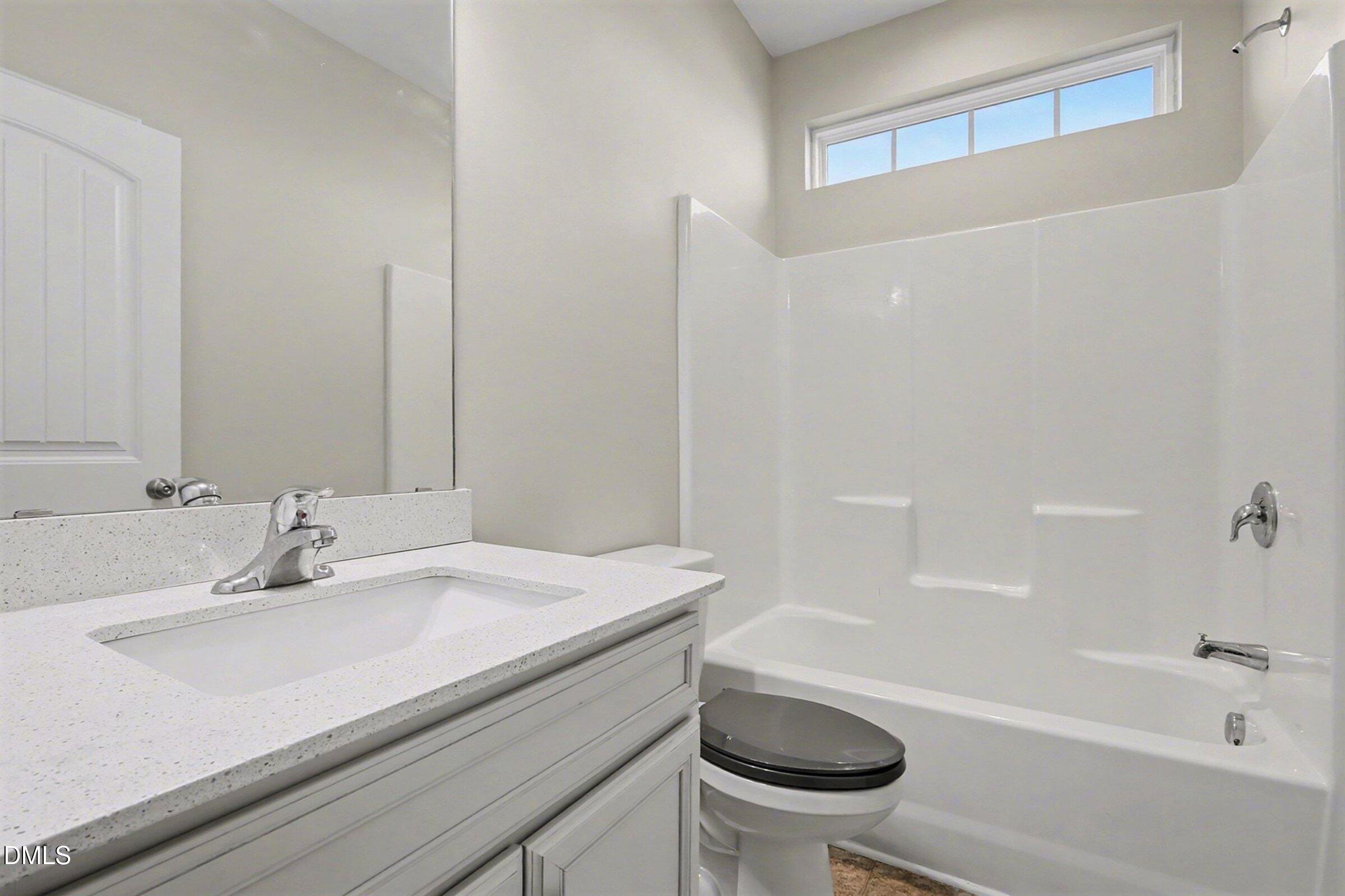 1946 Payne Road Haw River, NC 27258 - Photo 30 of 37 a bathroom with a sink a toilet and a bathtub