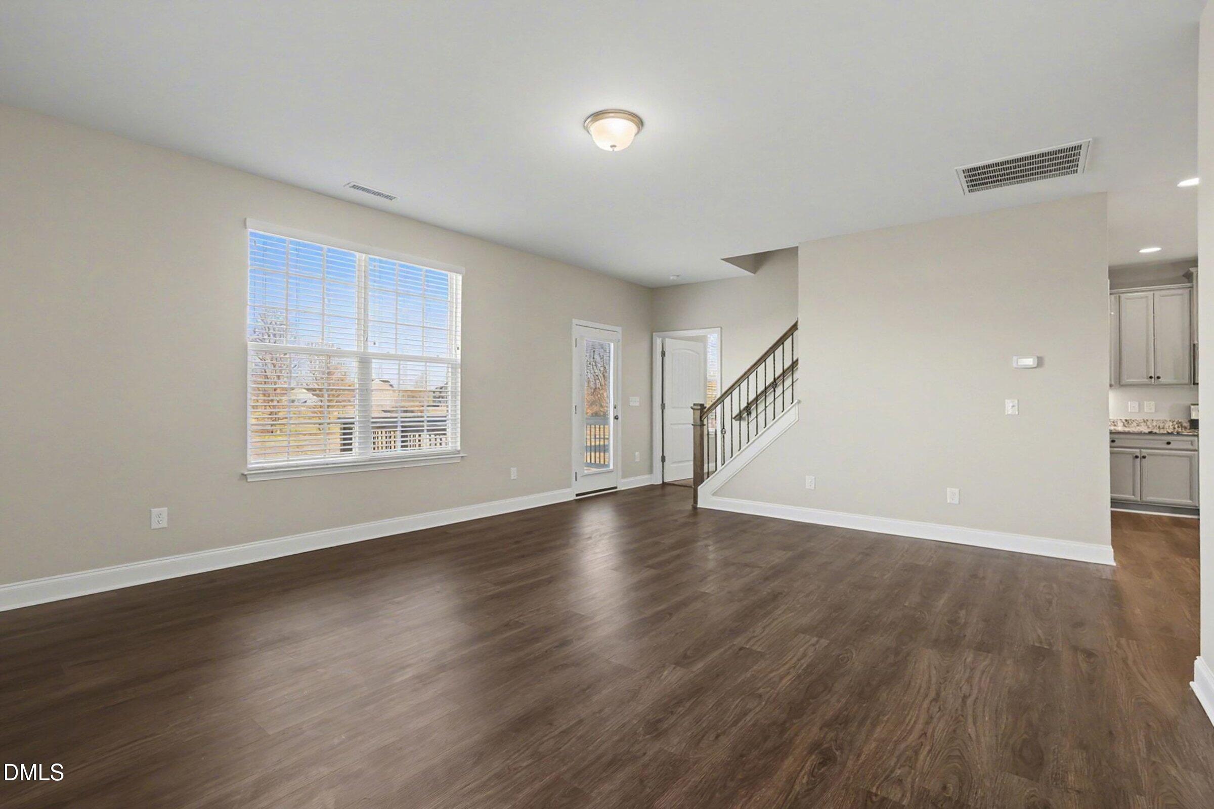 1946 Payne Road Haw River, NC 27258 - Photo 7 of 37 a view of an empty room with wooden floor and a window