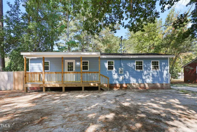 front view of a house with a patio