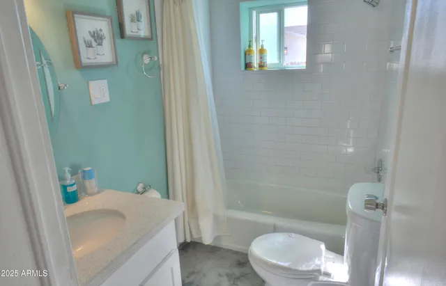 a bathroom with a sink and toilet