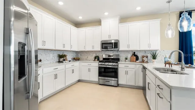 a view of a dining room with furniture and a potted plant