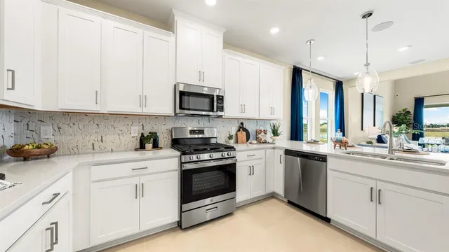 a kitchen with a dining table chairs and view kitchen