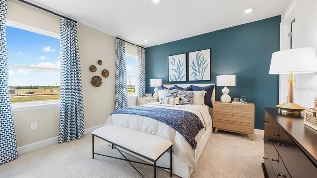 a view of a lake with a table and chairs