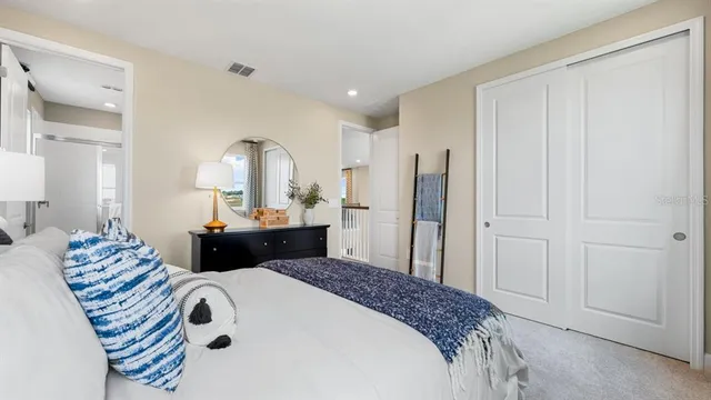 a view of a swimming pool with a table and chairs under an umbrella