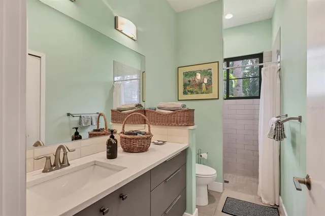 a bedroom with a bed and a table