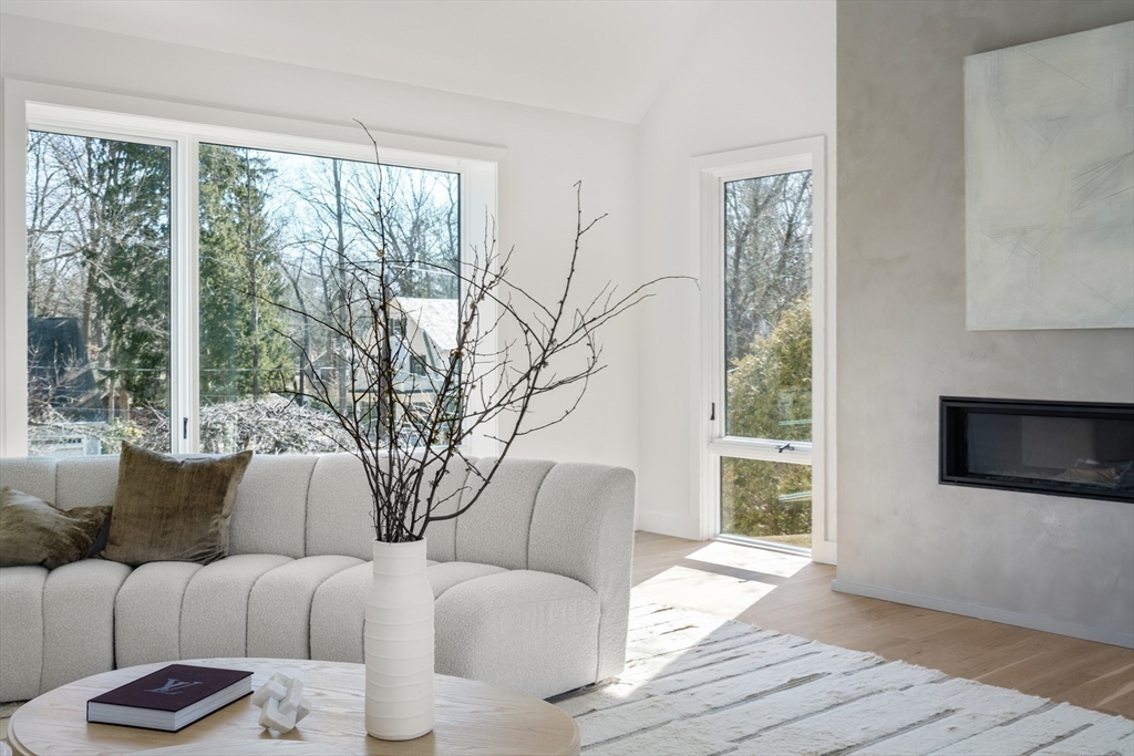 21 White Oak Road Newton, MA 02468 - Photo 13 of 27 a living room with furniture and a flat screen tv