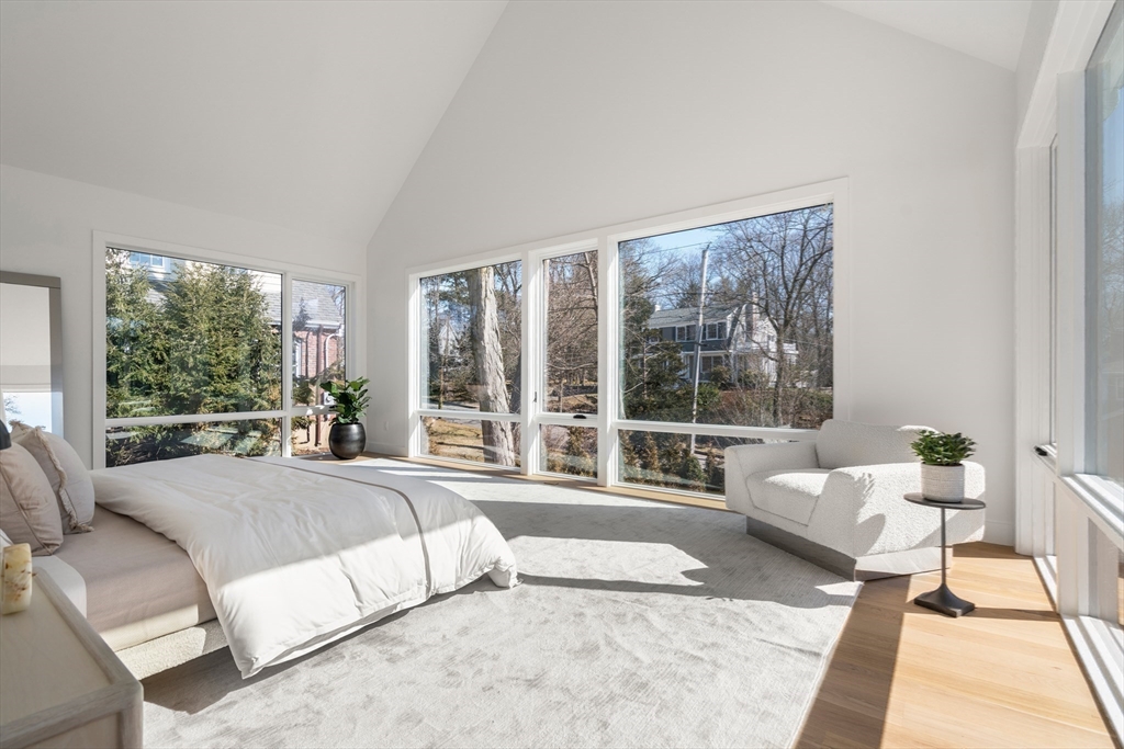 21 White Oak Road Newton, MA 02468 - Photo 14 of 27 a spacious bedroom with a bed and large windows