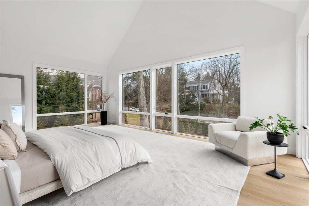 21 White Oak Road Newton, MA 02468 - Photo 15 of 27 a spacious bedroom with a bed couch and a large window