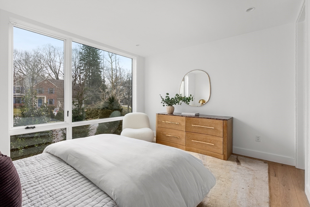 21 White Oak Road Newton, MA 02468 - Photo 17 of 27 a bedroom with a bed and a dresser