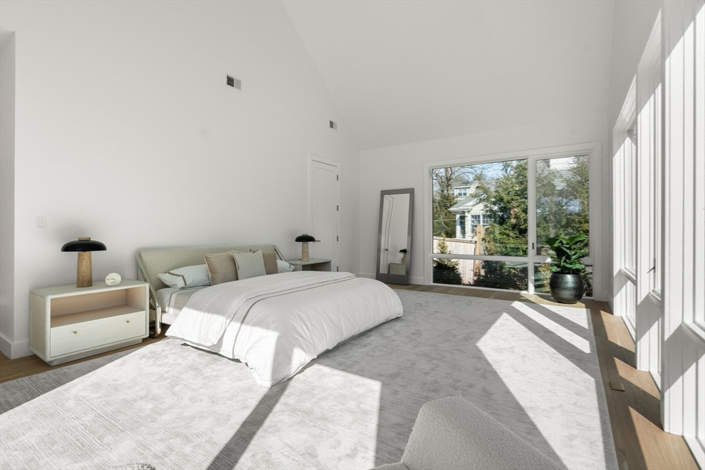 21 White Oak Road Newton, MA 02468 - Photo 18 of 27 a spacious bedroom with a bed and a large window