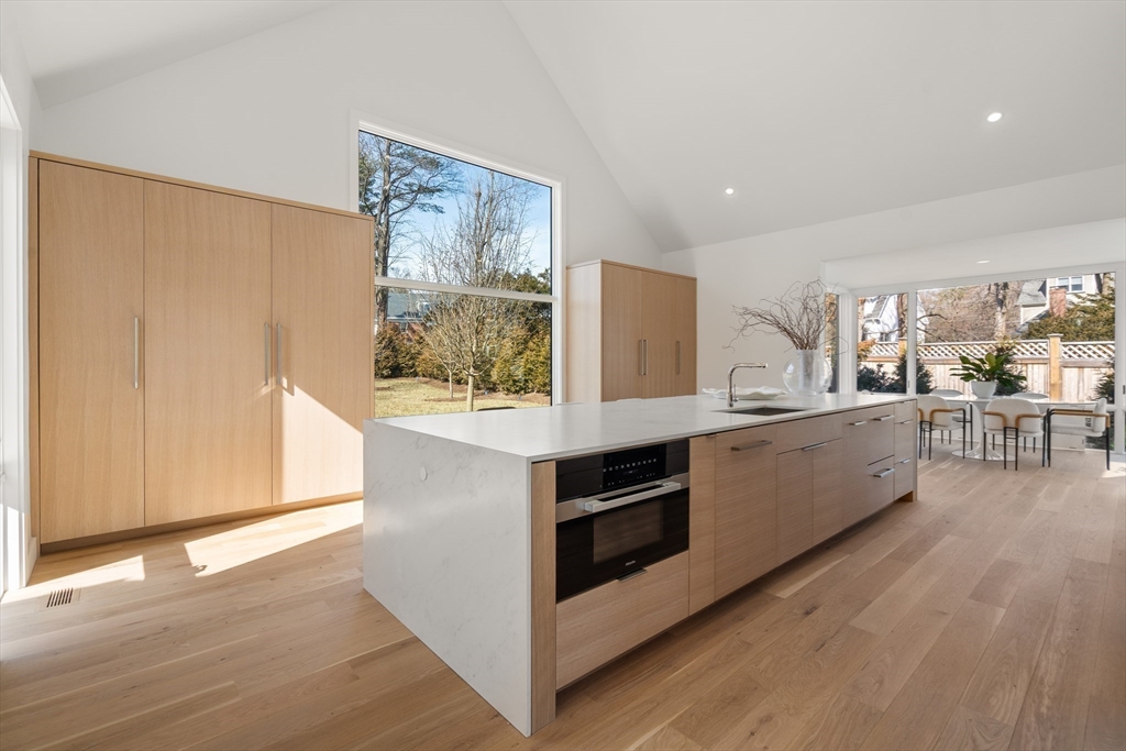 21 White Oak Road Newton, MA 02468 - Photo 2 of 27 a kitchen with stainless steel appliances cabinets and wooden floor