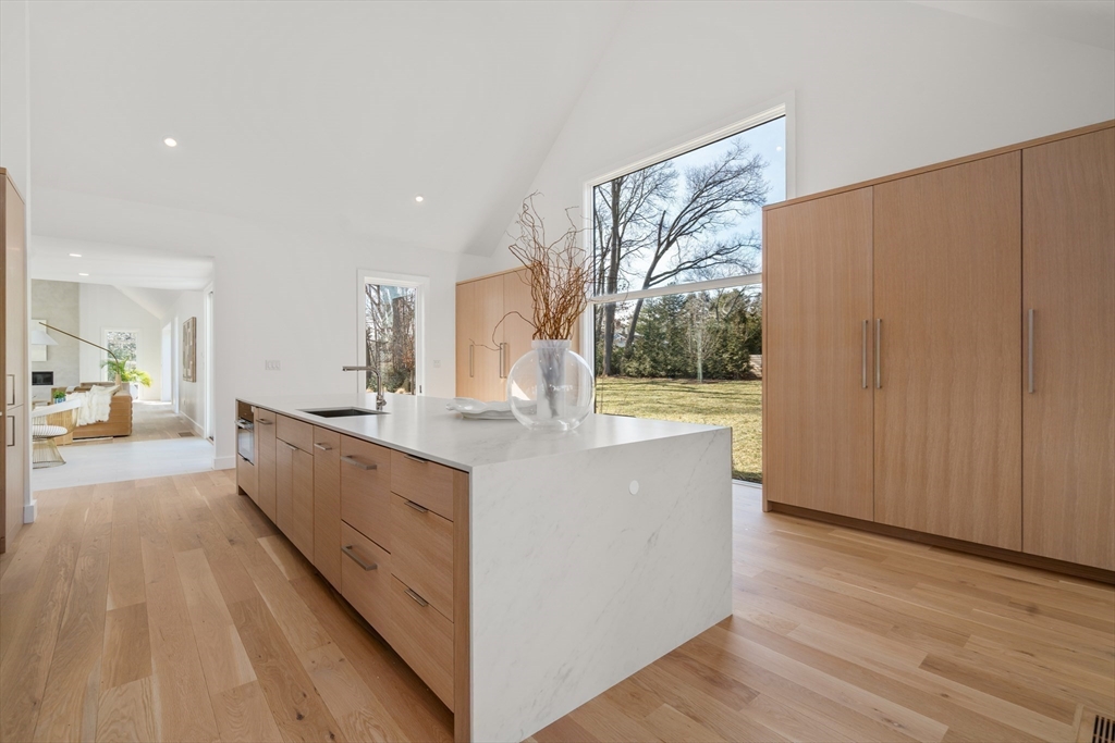 21 White Oak Road Newton, MA 02468 - Photo 4 of 27 a large room with a large window and furniture
