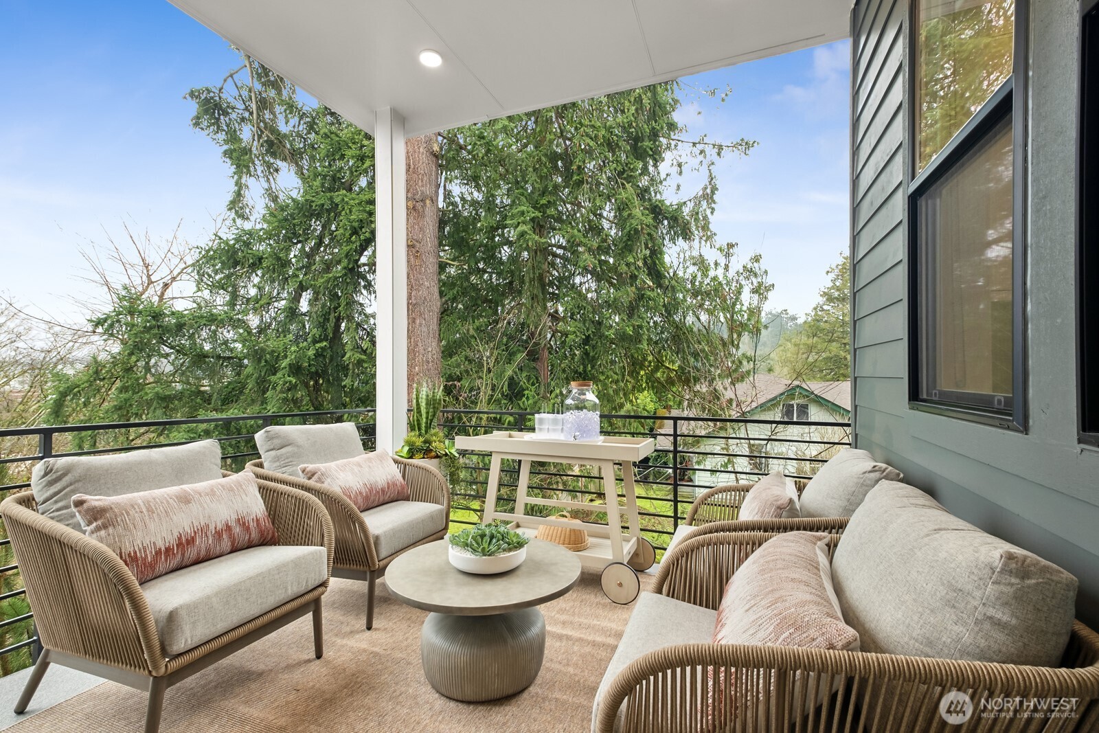 18809 99th Place Northeast, Unit A Bothell, WA 98011 - Photo 12 of 27 a balcony with furniture and a potted plant