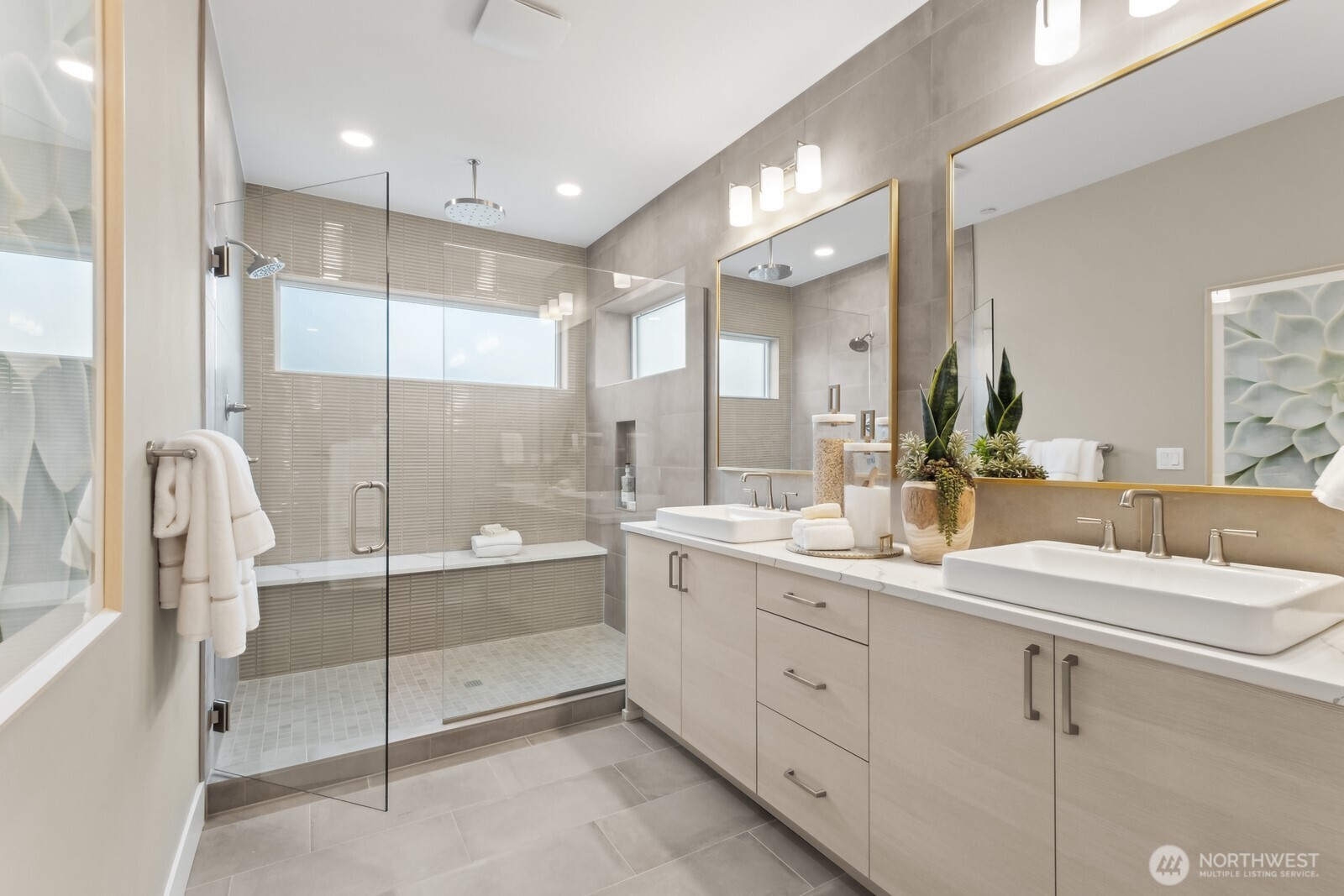 18809 99th Place Northeast, Unit A Bothell, WA 98011 - Photo 18 of 27 a bathroom with a double vanity sink mirror and shower