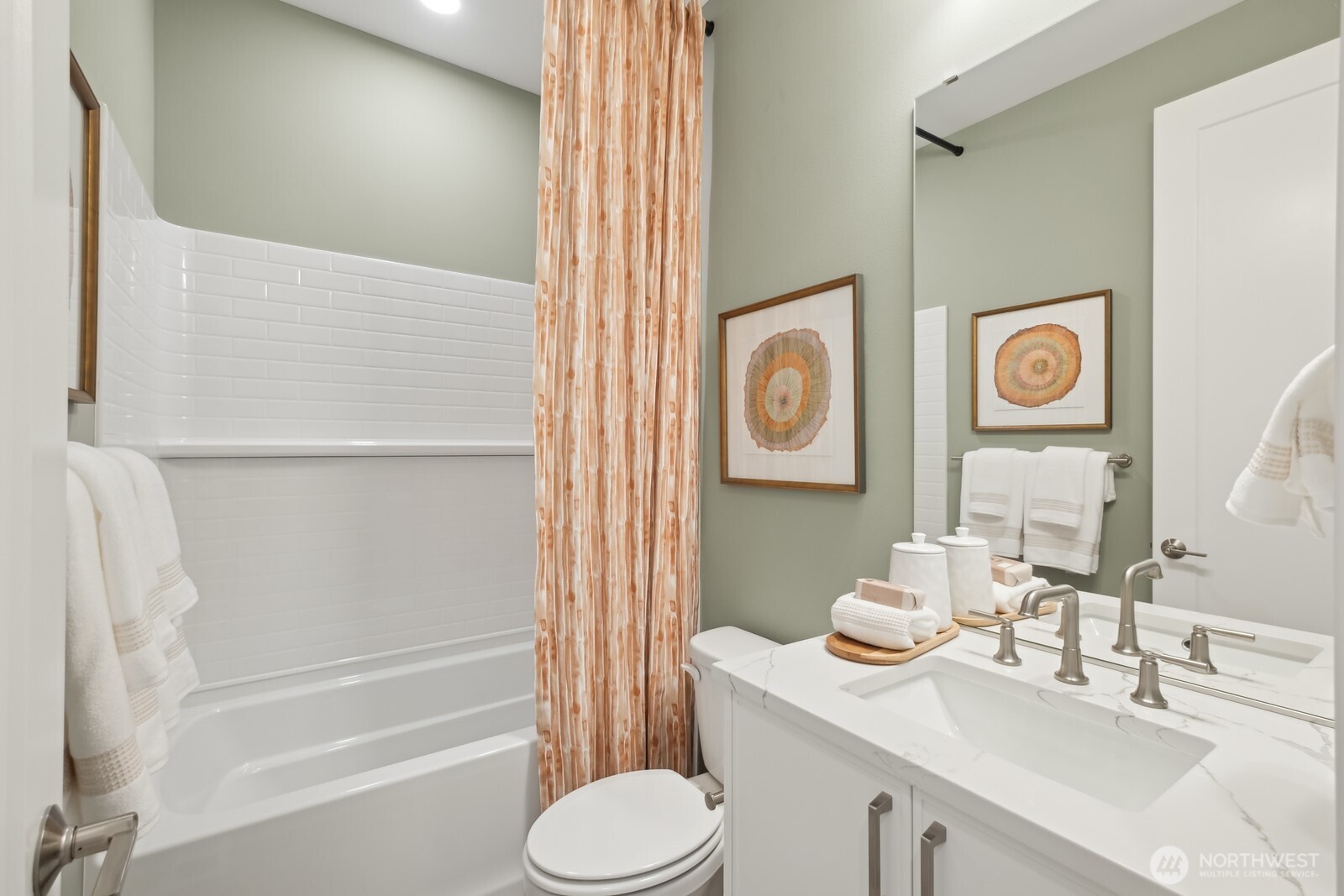 18809 99th Place Northeast, Unit A Bothell, WA 98011 - Photo 21 of 27 a bathroom with a sink vanity mirror and toilet