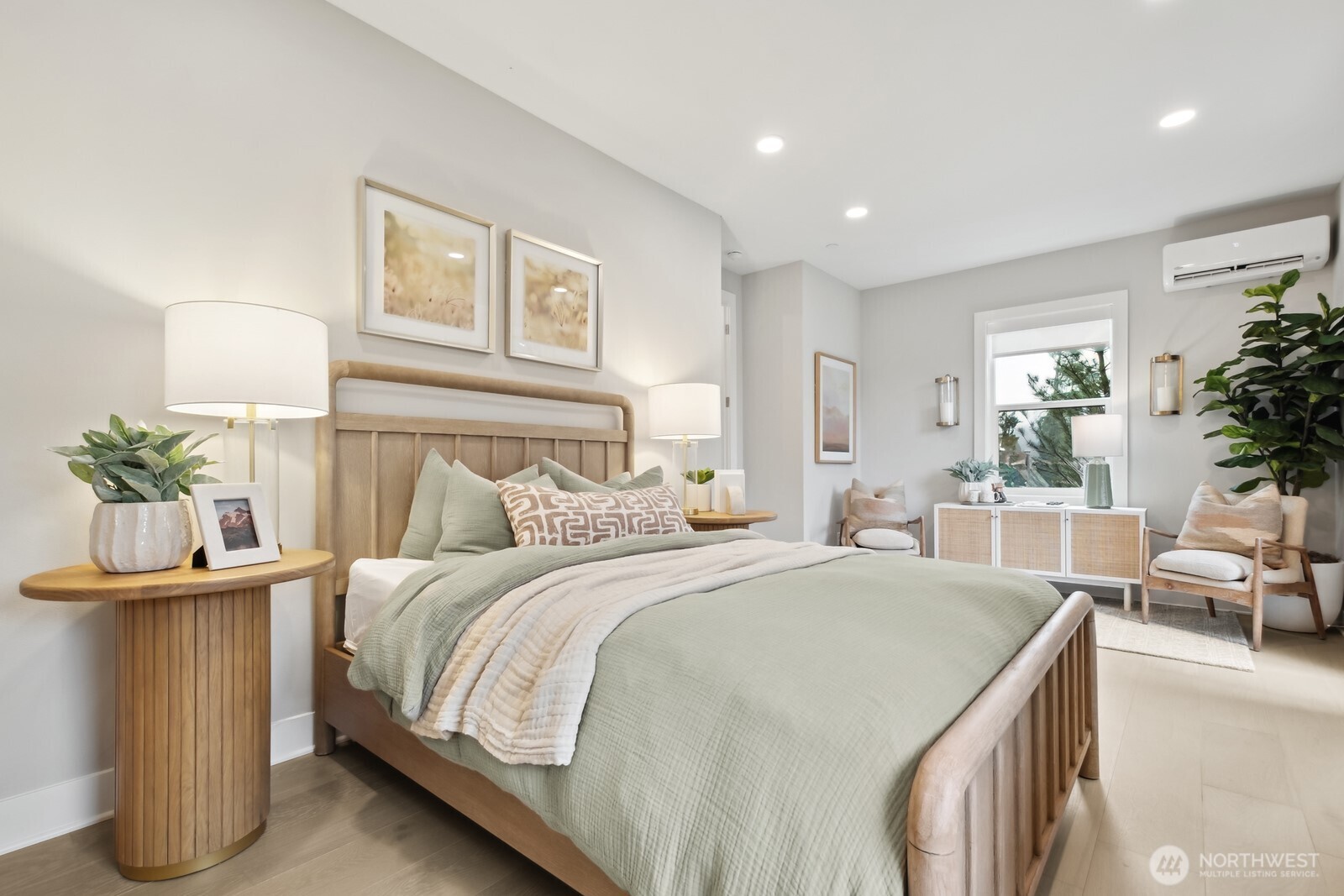 18809 99th Place Northeast, Unit A Bothell, WA 98011 - Photo 5 of 27 a bedroom with a bed and a potted plant