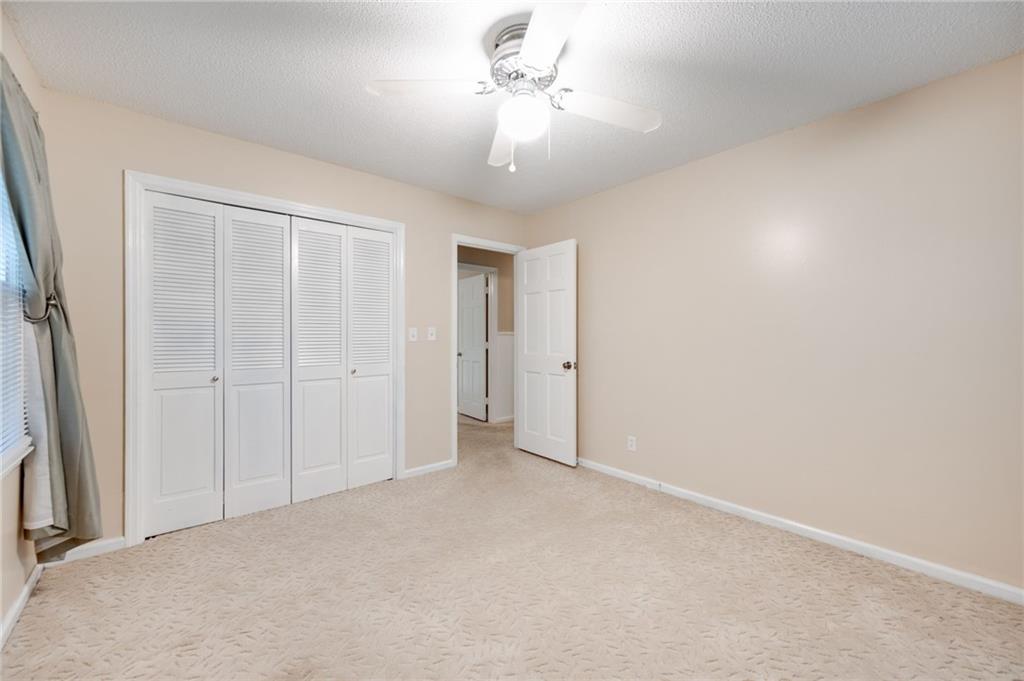 110 Pinewood Way Dalton, GA 30721 - Photo 30 of 35 a view of a big room with chandelier fan