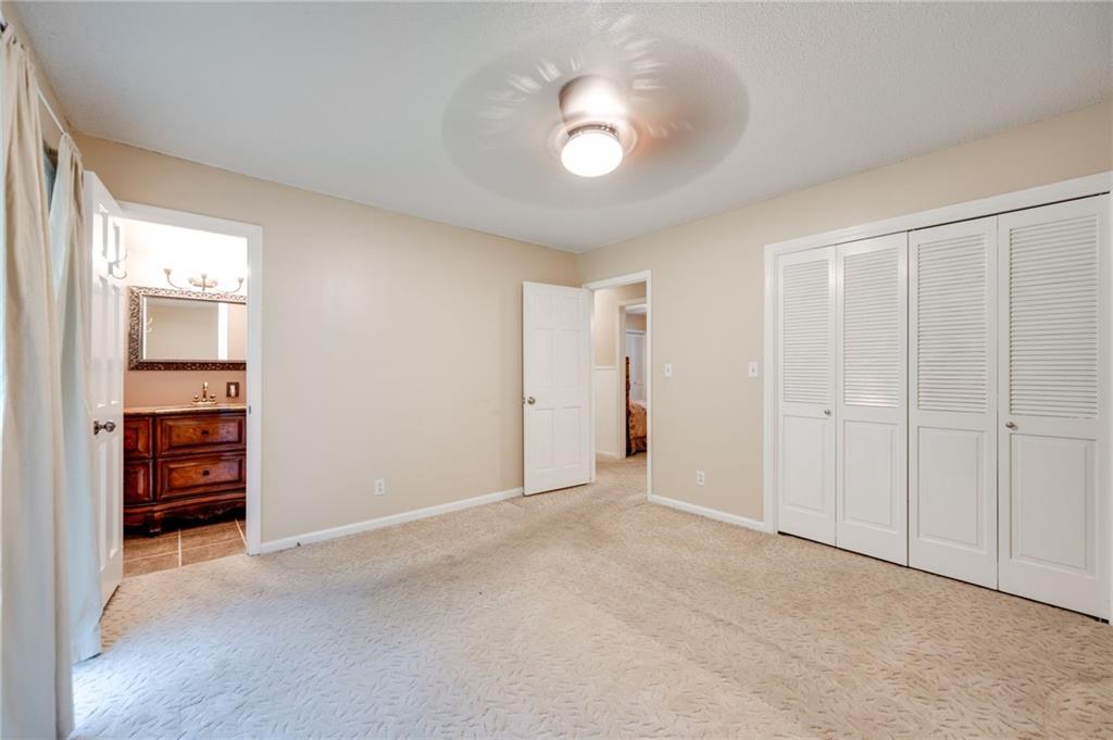 110 Pinewood Way Dalton, GA 30721 - Photo 32 of 35 an empty room with closet and a bathroom