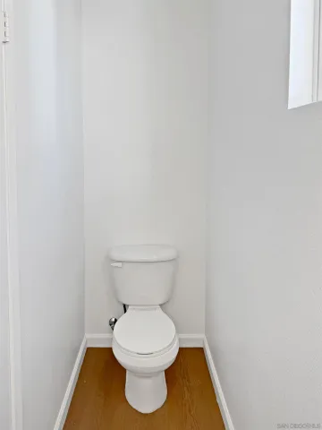 a white toilet sitting in a bathroom