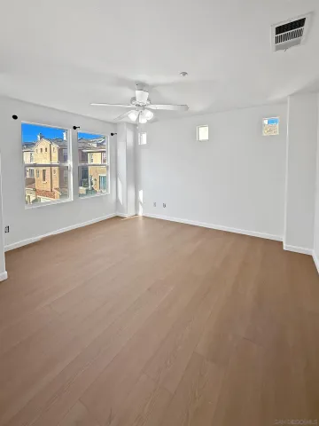 a view of an empty room with a window