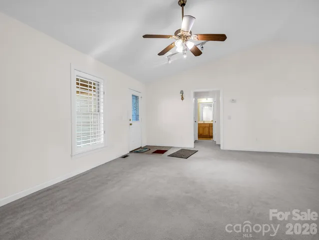 a bathroom with a glass shower door