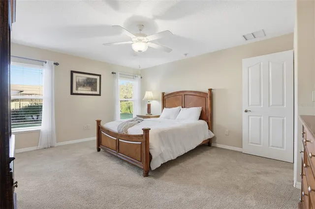 a view of an empty room with windows