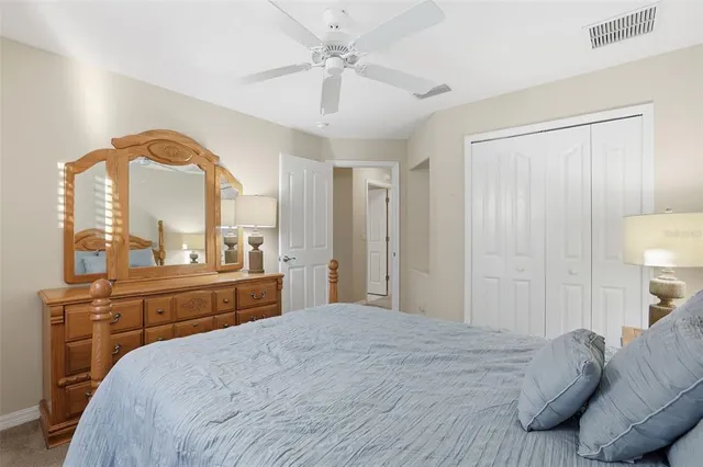a front view of a house with a yard and fountain in middle