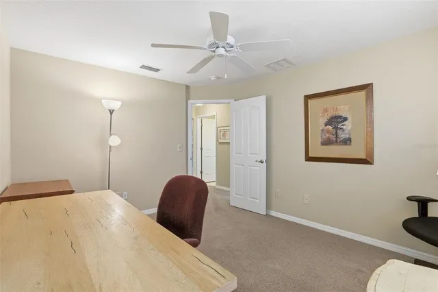 a view of a patio with table and chairs and potted plants