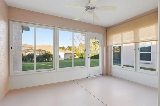 an aerial view of residential houses with outdoor space and swimming pool