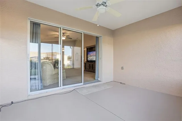 a view of a chairs and table in the patio