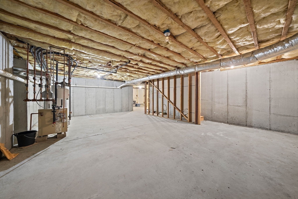 14 Sugar Maple Circle, Unit 14 Hanover, MA 02339 - Photo 30 of 38 a view of an empty room with a garage