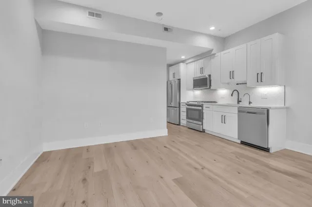 a view of kitchen with wooden floor
