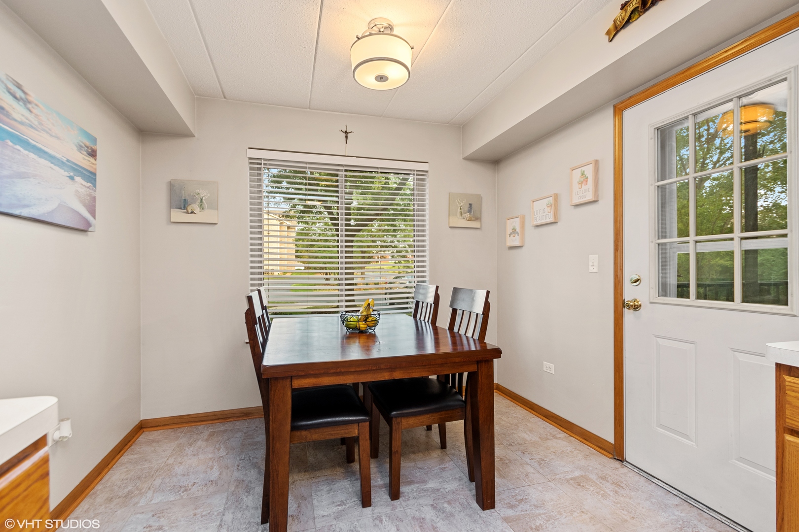 6850 Ridge Point Drive, Unit 1A Oak Forest, IL 60452 - Photo 11 of 20 a view of a dining room with furniture window and outside view
