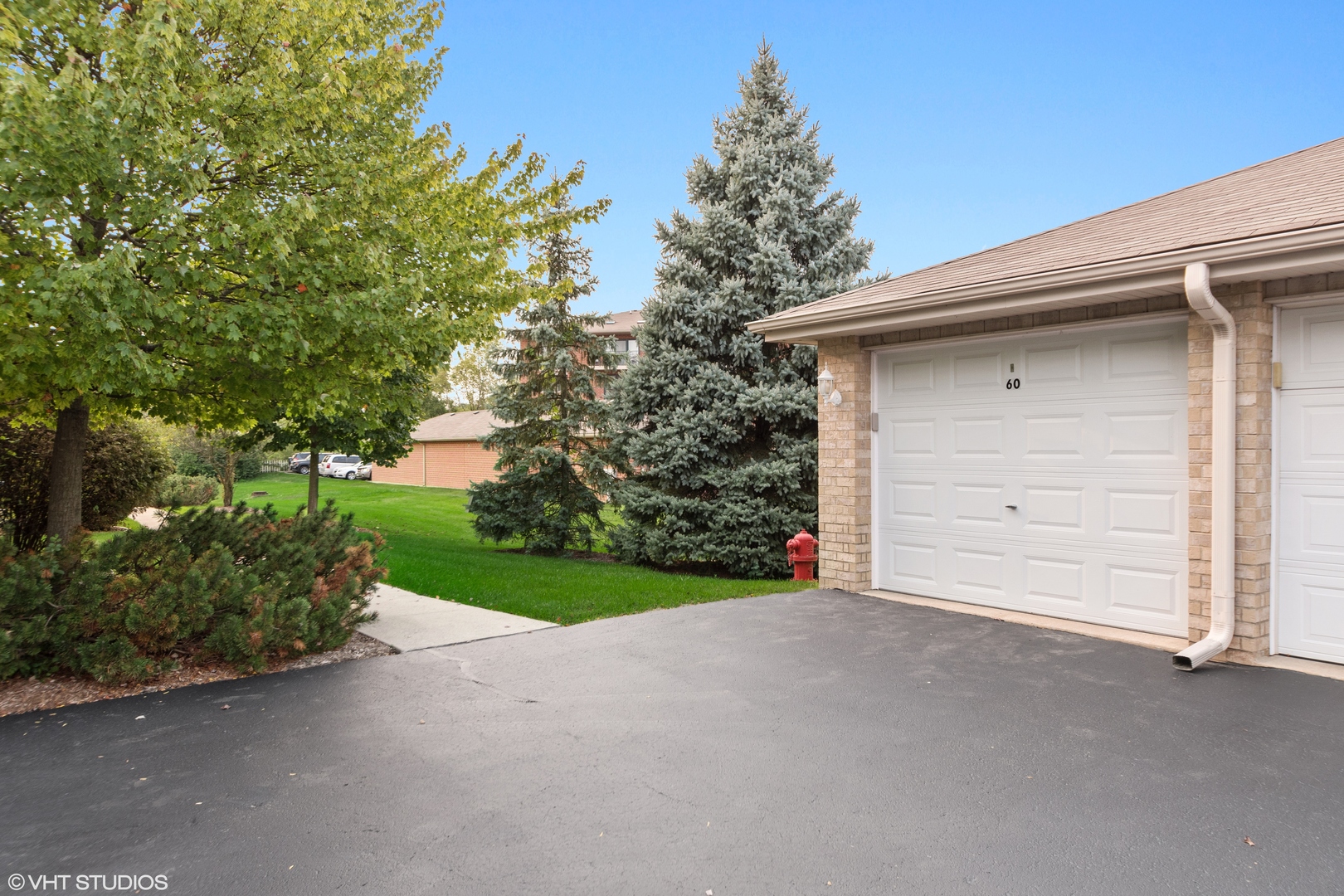 6850 Ridge Point Drive, Unit 1A Oak Forest, IL 60452 - Photo 19 of 20 a view of a house with a garage