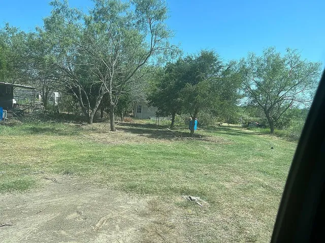 a view of outdoor space with deck and yard
